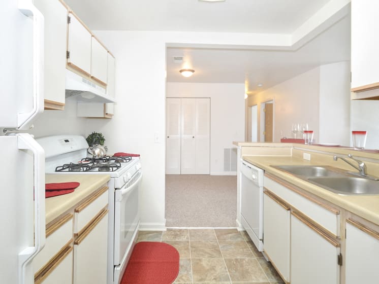 Open Layout Kitchen with White Appliances